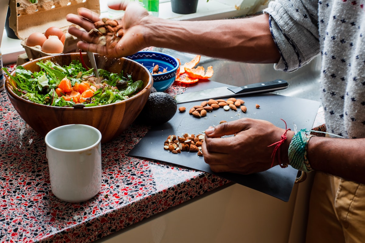 Men preparing healthy meals in kitchen